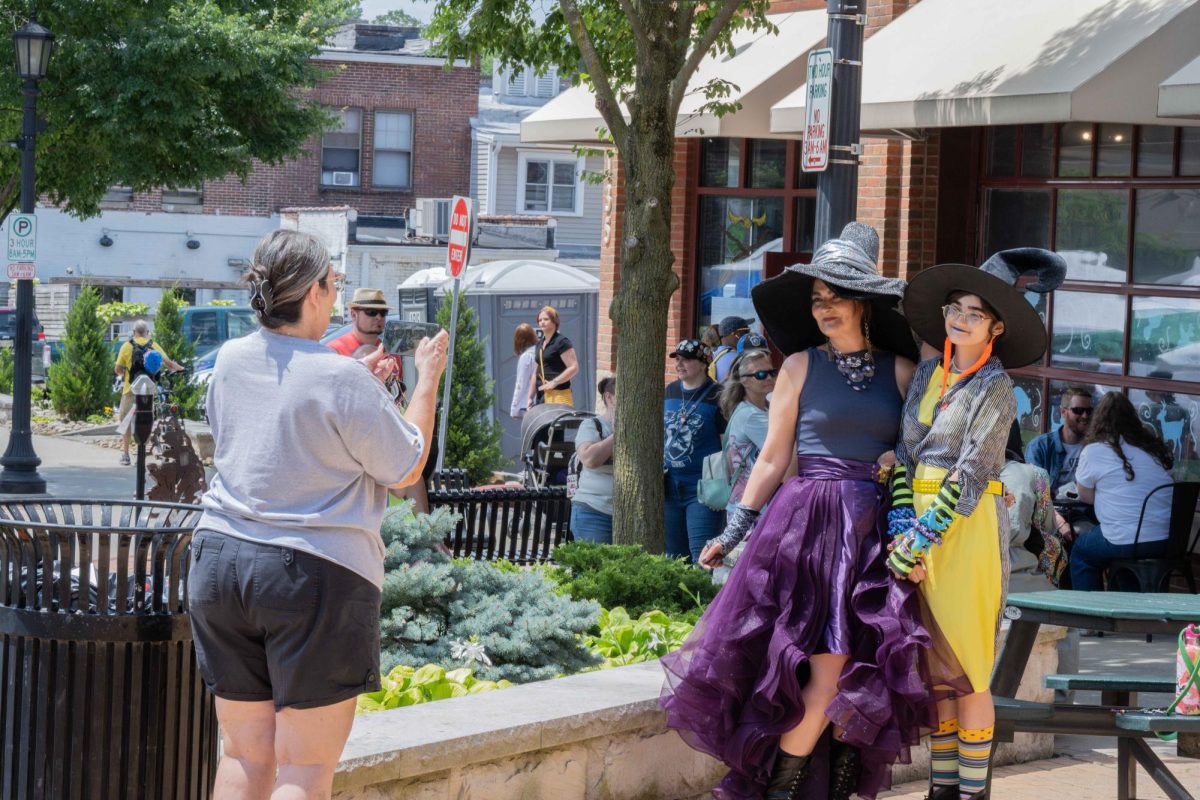 Amanda Kidd and Vivian Kidd get their photo taken for having cool costumes at the "Harry Potter" festival in Downtown Kent. 