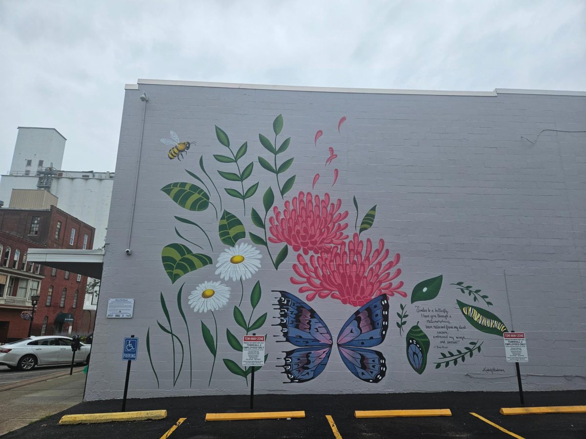 The "Tosha Garden" mural, on the side of the downtown Townhall II building, serves as a symbol of growth for those experiencing mental illness.