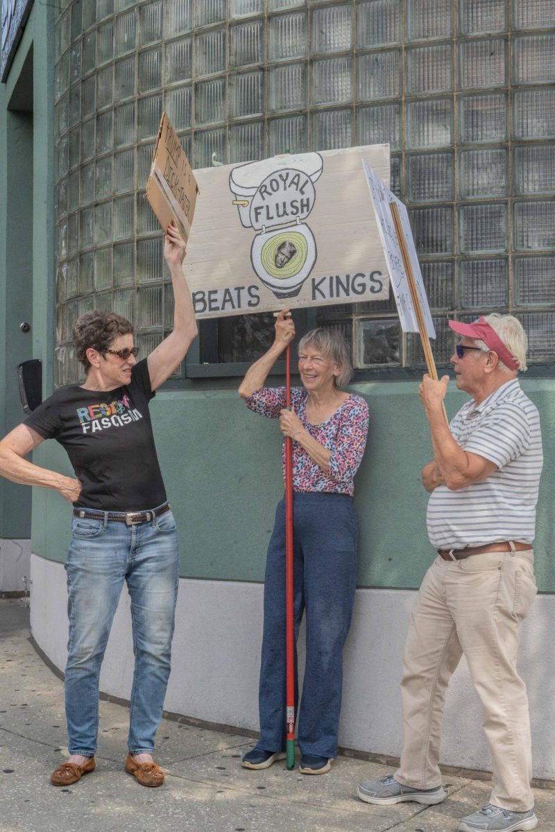 Kate Fox, Joan Bellis, and Bill Petrosky attend the "Good Trouble Lives on" protest on Thursday, July 17.  