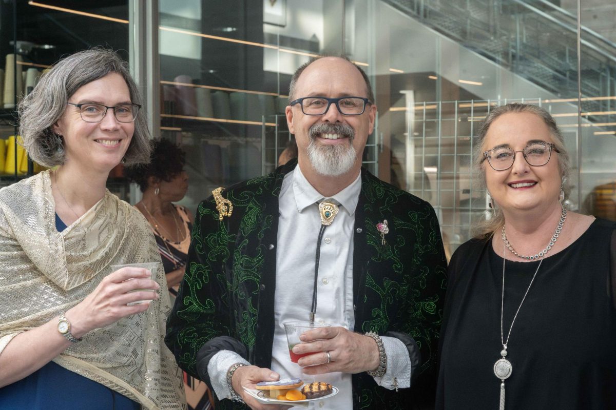 Sara Humethe curator of the exhibit, Matt Adamson, and Dr Maryann Marazzi attend the Sparkle event at the Kent State University Museum. 