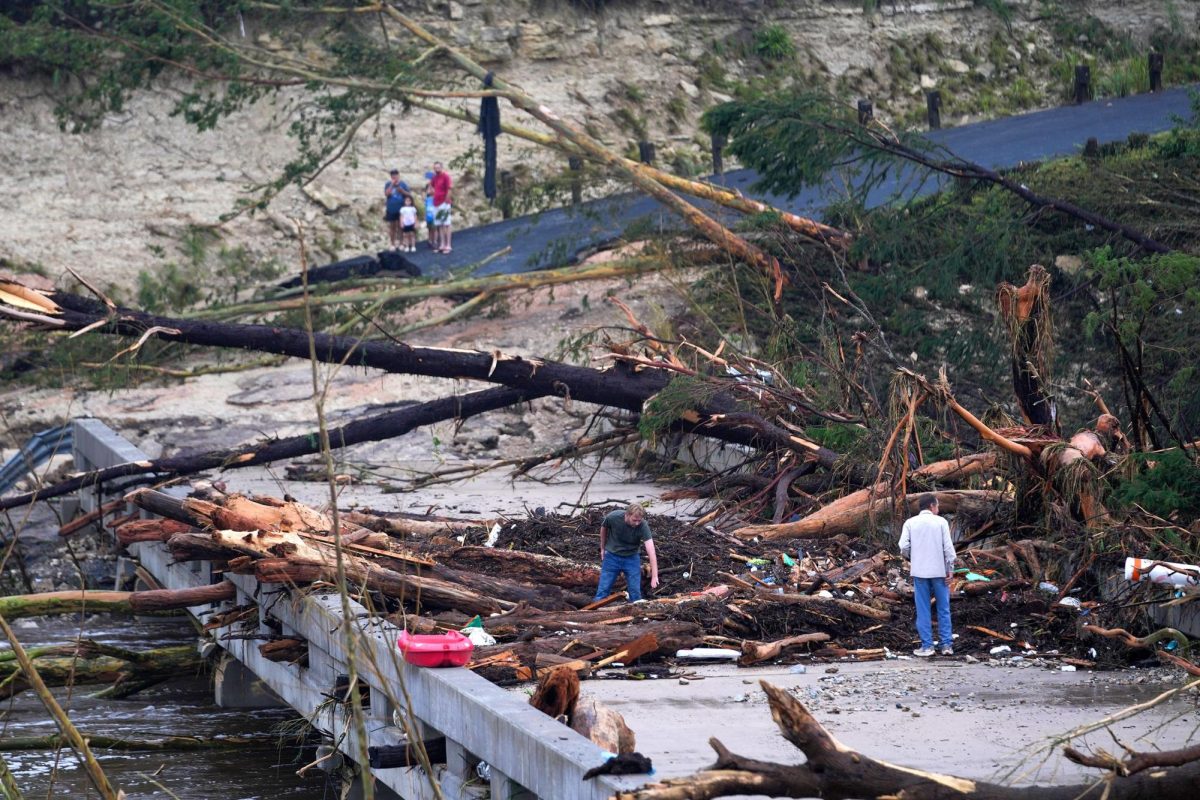 Debris covers a bridge over the Guadalupe River after a flash flood swept through the area in Ingram, Texas.