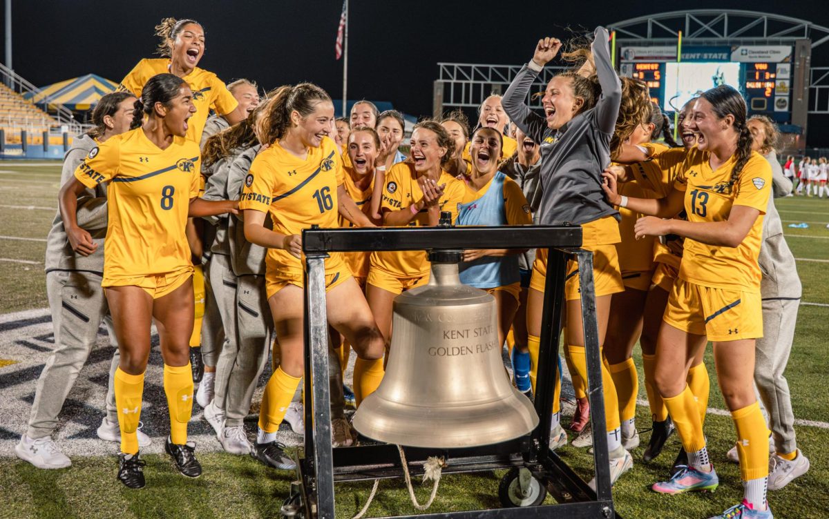 Kent State Women's soccer team celebrates their five to one win against YSU as they ring the victory bell on Aug. 28, 2025. 