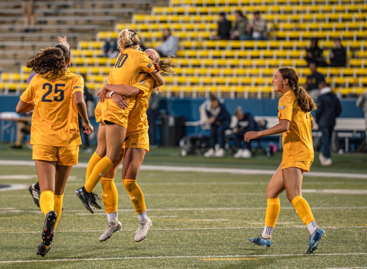 Kent sophomore Abby Cusick, 10, celebrates with junior Samantha Miller, 2, after scoring a goal against YSU on Aug 28, 2025. This made the score against YSU tied with one to one.