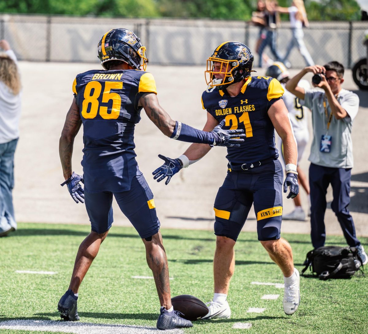 Kent graduate student Sebastian Brown, 85, and redshirt freshman Cade Wolford, 21, celebrate touchdown against Merrimack on Aug. 30, 2025. This made the score seven to zero with Kent in the lead.