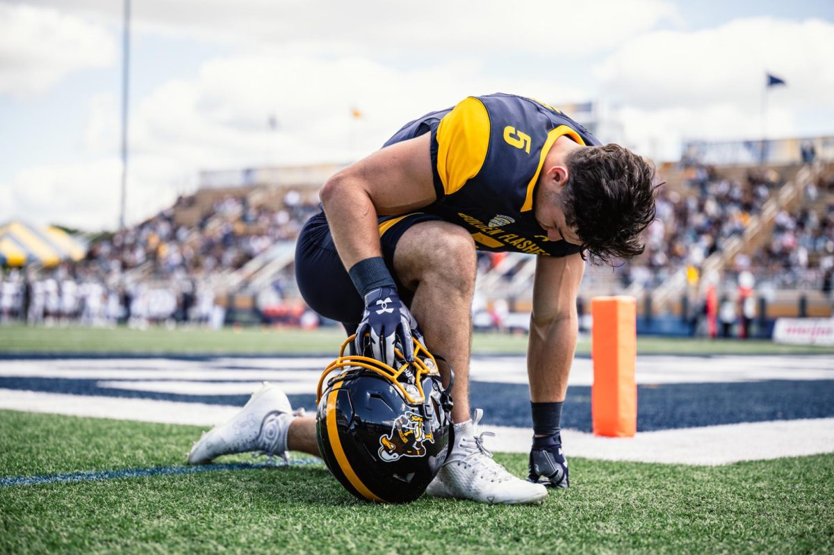 Kent State redshirt junior running back Gavin Garcia kneels before the beginning of the game against Merrimack on Aug. 30, 2025.