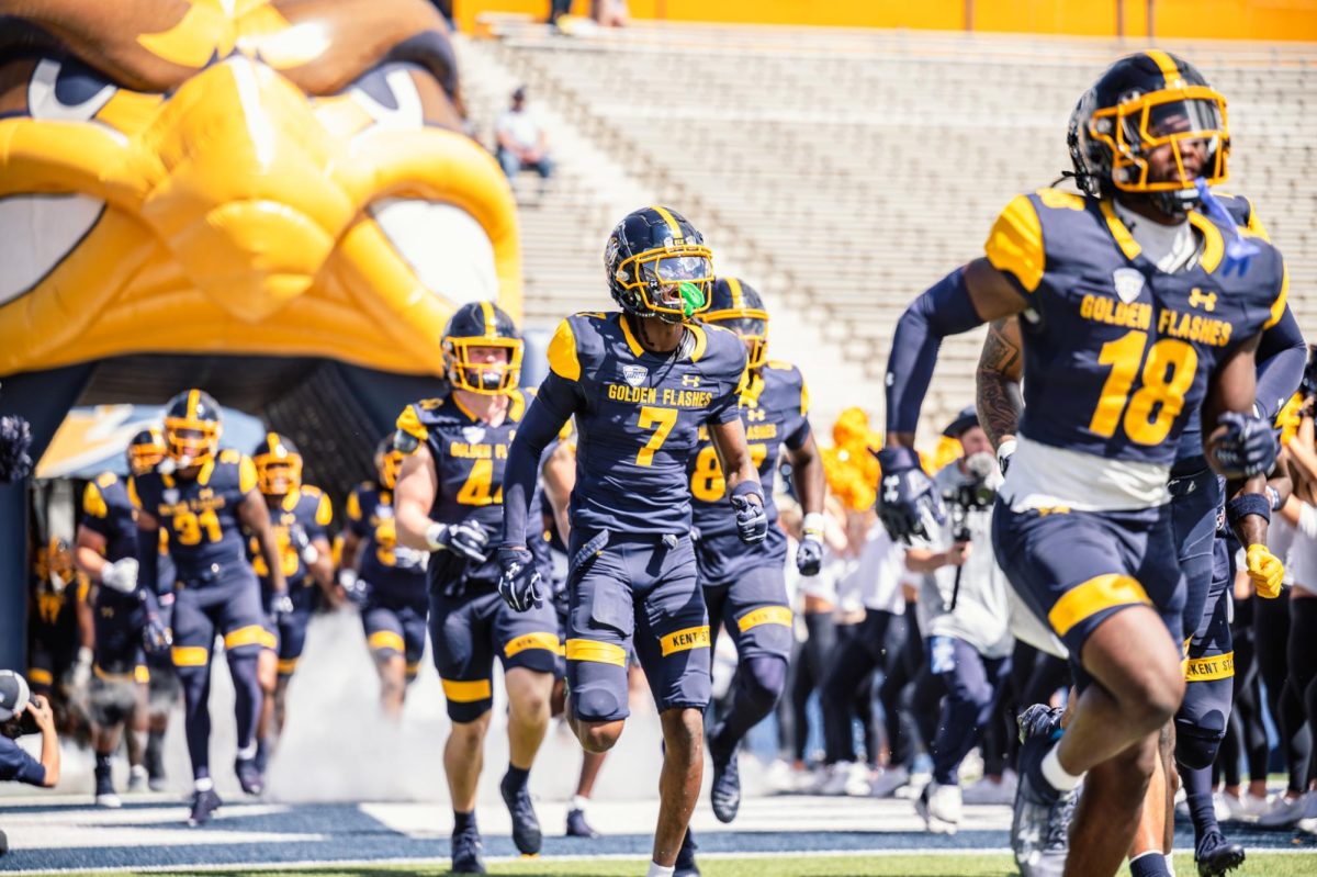 Kent football team runs out the tunnel before their game against Merrimack on Aug. 30, 2025.