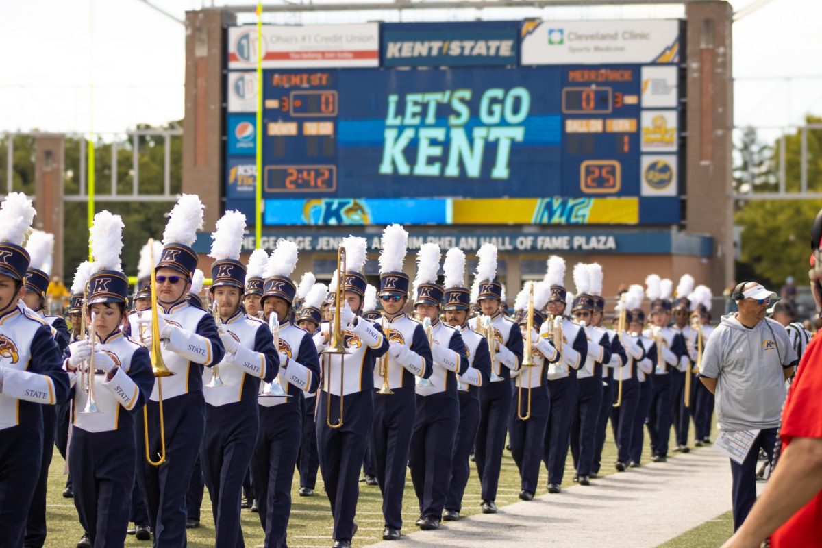 The marching band marches off the field after the national anthem at the home opener on Saturday, Aug. 30, 2025 at Dix Stadium.