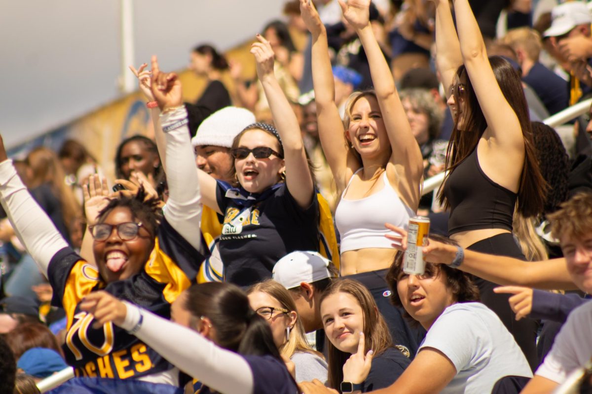 From the student section, students cheer on The Golden Flashes against Merrimack College Warriors on Saturday, August 30.
