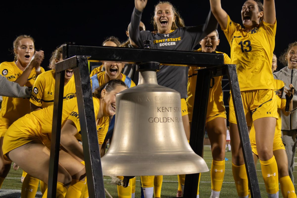 Kent State Women's Soccer team cheers as senior defender, Abby Breitschuh, 16, rings the victory bell after their win against Youngstown State on Thursday, August 28, 2025.