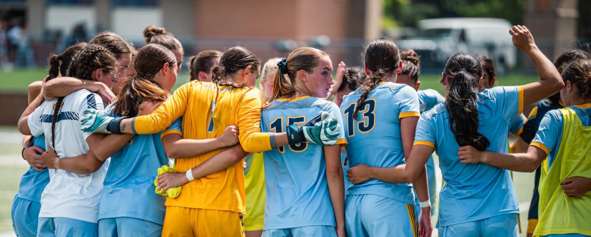 Kent state soccer team huddles up before their game against Duquesne on Aug 17, 2025. 