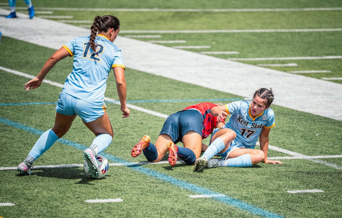 Kent sophomore Jules Dolinski, 12, steals the ball back from Duquesne defender, Paige Kuisis during the first half of their game on Aug 17, 2025. 