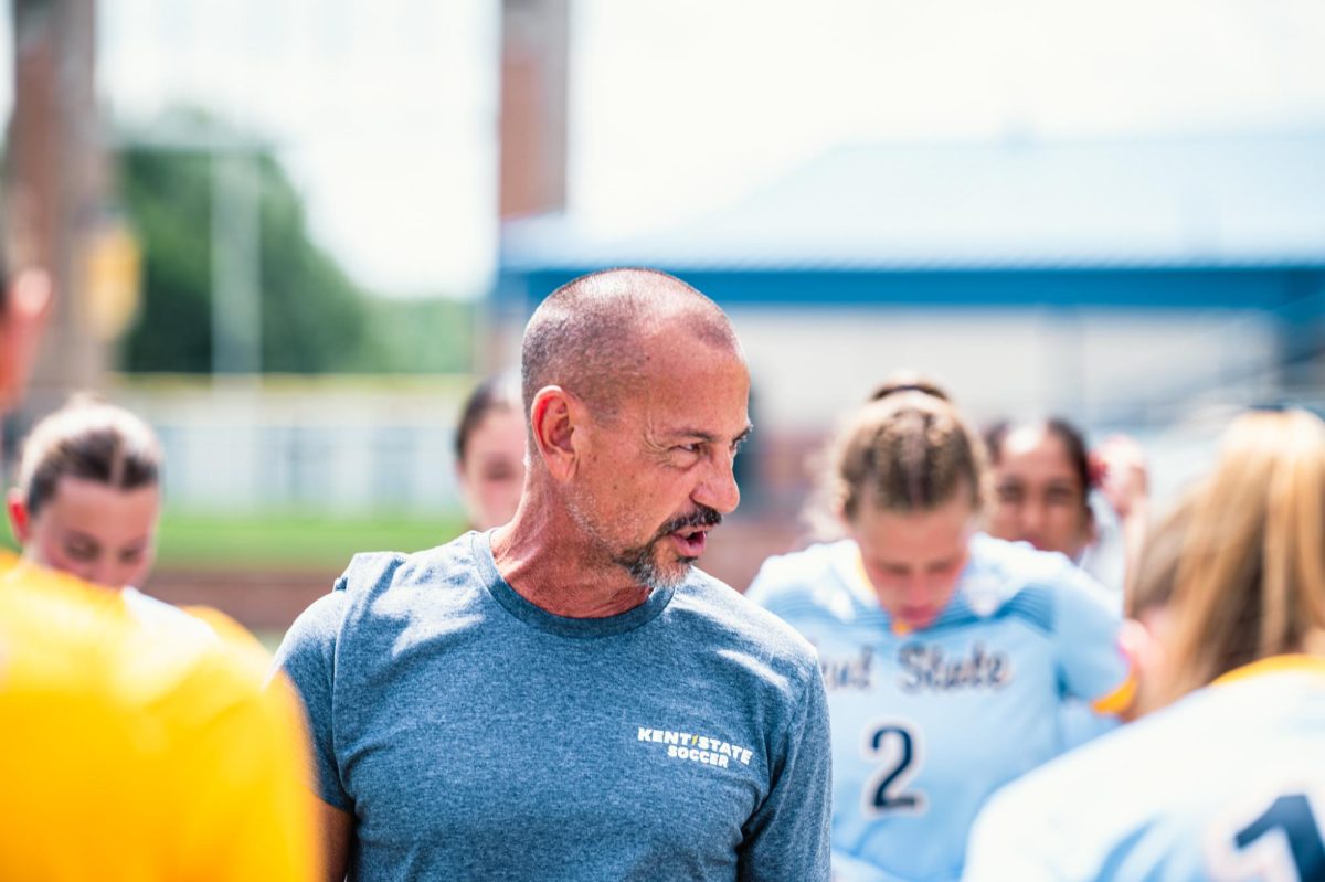 Kent state women's soccer coach, Rob Marinaro, talks to the team as they huddle up before their game against Duquesne on Aug. 17, 2025. 