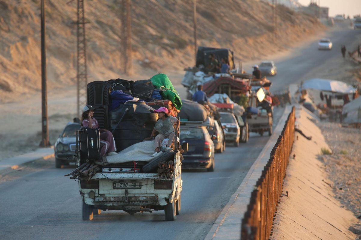 Palestinians flee their homes as intense Israeli attacks on northern Gaza force them to head toward central Gaza via al-Rashid Road, carrying whatever belongings they can, on August 29.