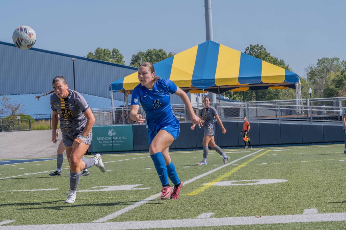 Ali Weibel, sophomore, fights for the ball in the game against Buffalo.
