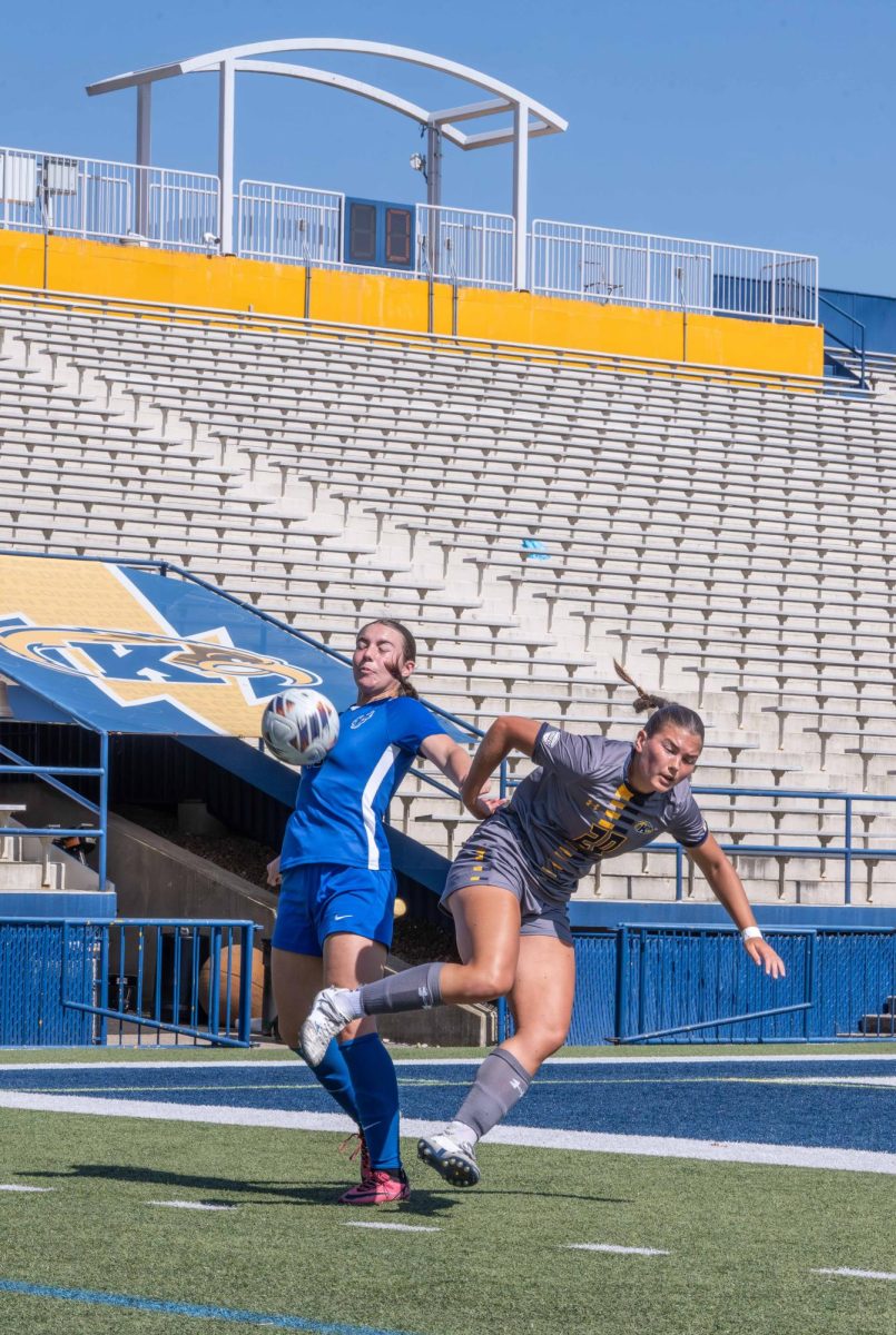 Ali Weibel, a sophomore, collides with Buffalo while going after the ball on Sunday, 28th,2025. 
