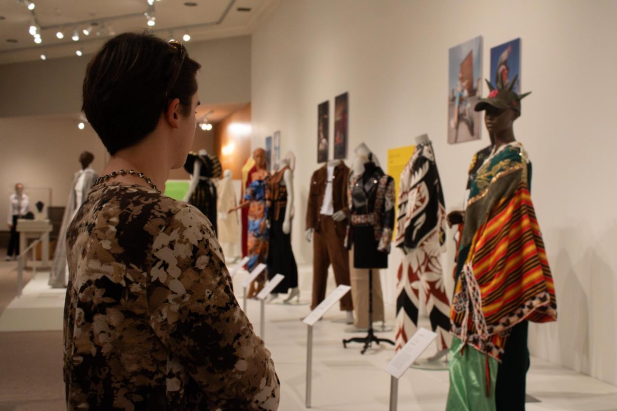 Kent sophomore, Harrison Miller, art history major and Vice President of the Kent State Museum Society looks at the pieces of the "A Meeting of Cultures: Fashioning North Africa" exhibit in the Fashion Museum on Friday, Sept 5, 2025. The Kent State Fashion museum is located on 515 Hilltop Drive, Kent, Ohio.