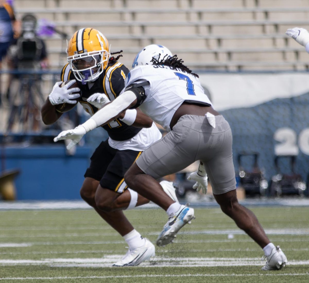 Kent redshirt sophomore, Jahzae Kimbrough  runs around Buffalo sixth year, Solomon Brown, as he tries to tackle him during the second quarter of their game on Saturday, Sept 13, 2025. 