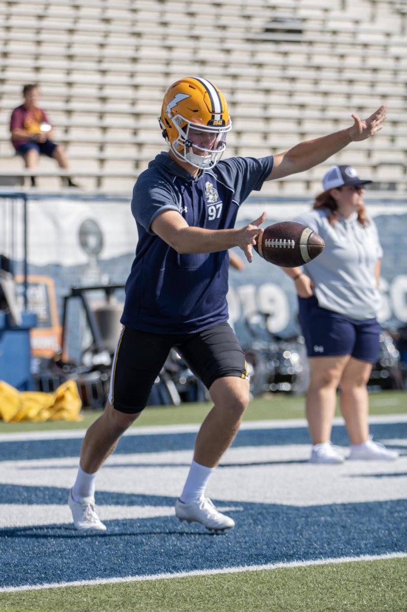Kent freshman, Jake Stoeckel starts to punt the ball during warms up before their game against University of Buffalo on Saturday, Sept 13, 2025.