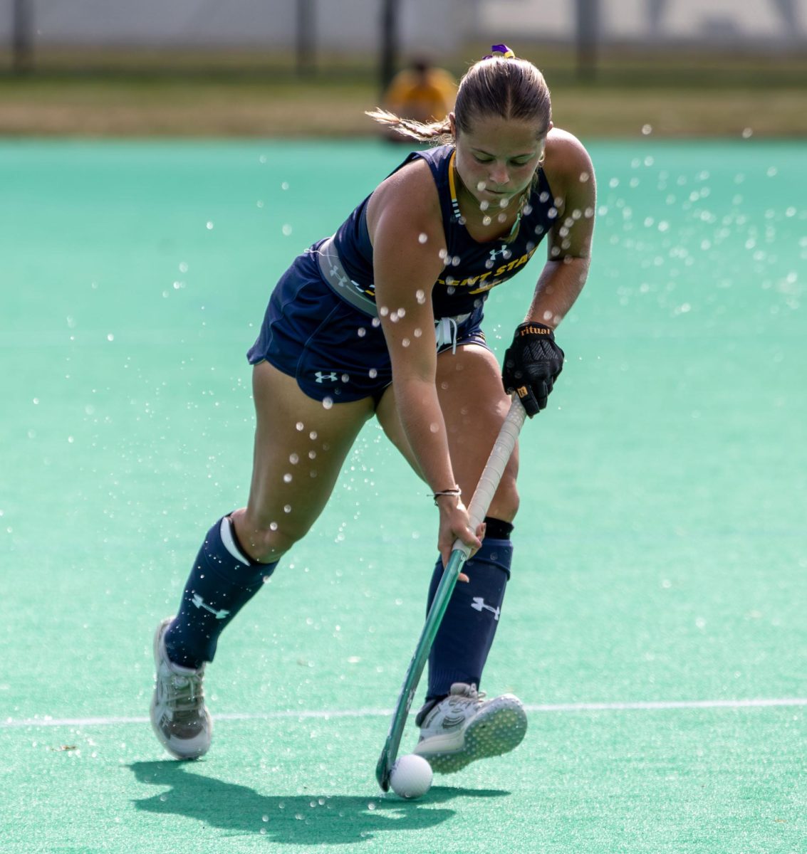 Kent senior forward, Emma Seger, 3, moves the ball through the wet turf during the third quarter of their game against Miami of OH on Friday, Sept. 26, 2025.