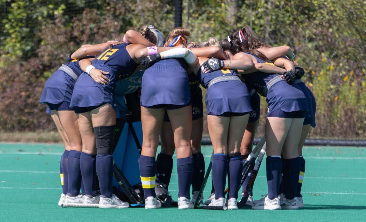 Kent field hockey players huddle for a pregame talk before the start of their game against Miami of OH on Friday, Sept. 26, 2025.