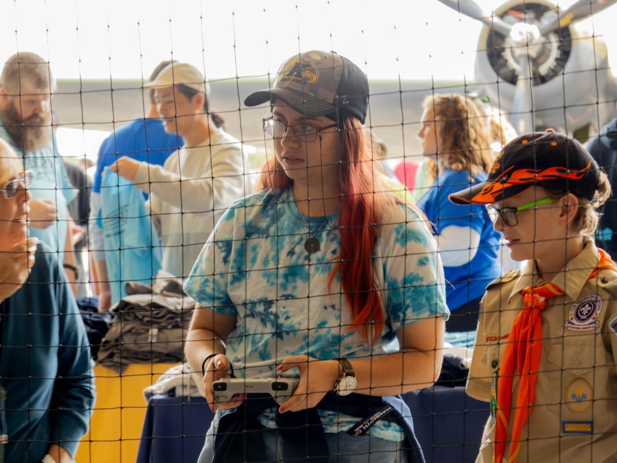 Alix Hernandez, a senior unmanned systems flight operations major, pilots a Mini 3 Pro drone at the annual Engineering & Aeronautics Expo on Sept. 6, 2025.