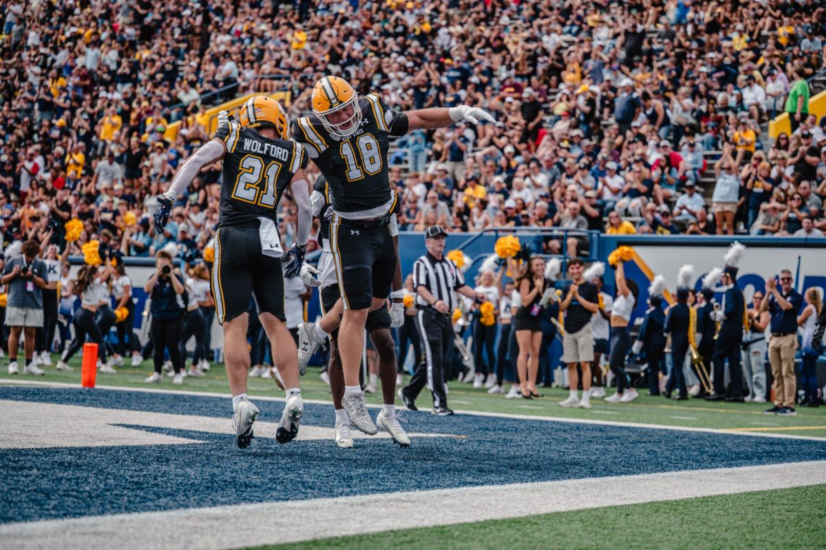 Kent redshirt freshman Cade Wolford, 21, and redshirt junior Hunter Hopperton, 18, celebrate touchdown made by Cade against Buffalo on Sept. 13, 2025. This made the score 0-14 with Kent still leading.