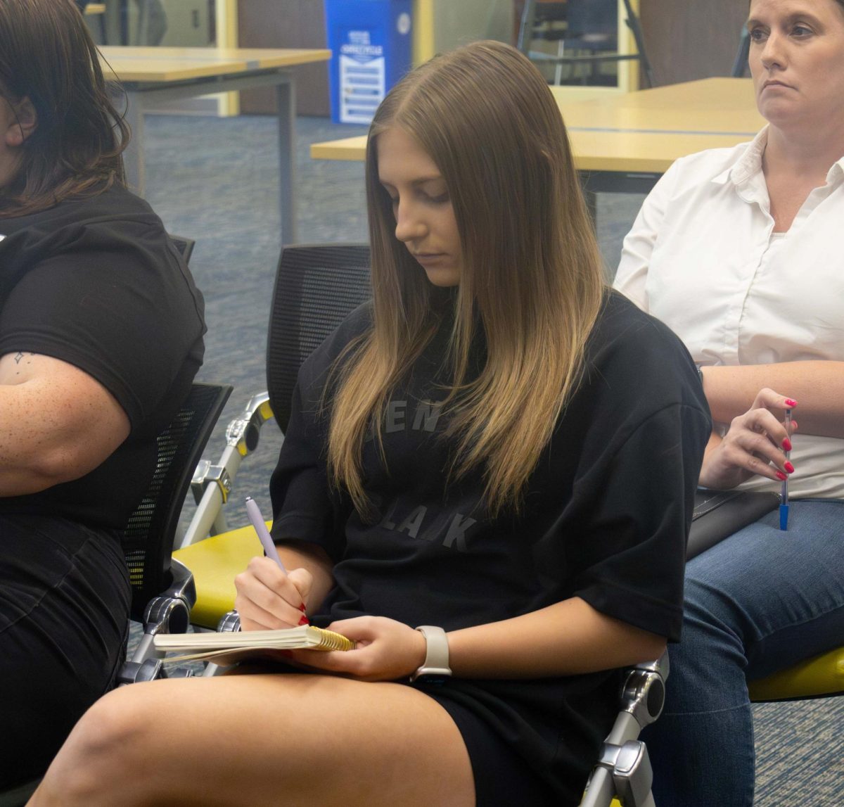 Junior Business Management major Kylie Carpenter takes notes for one of her classes at the Equal Protection Under the Law Constitution Day event, Sept. 17, 2025.