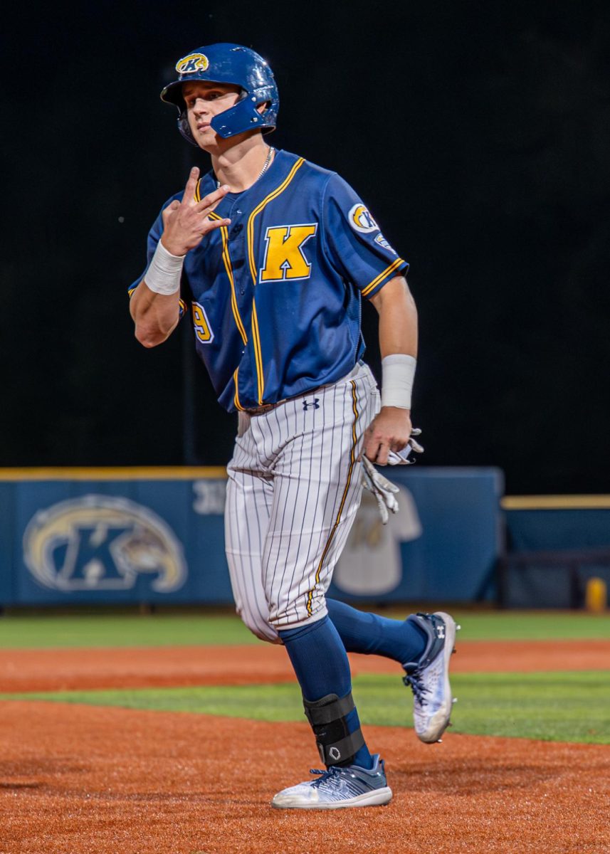 Kent redshirt freshman Nolan Belcher throws up a 'W' after their win against Malone on Sept. 26, 2025.