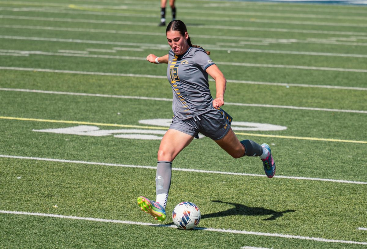 Kent sophomore Allison Collins kicks upfield during the first half of the game against Buffalo on Sunday, Sept. 28, 2025.