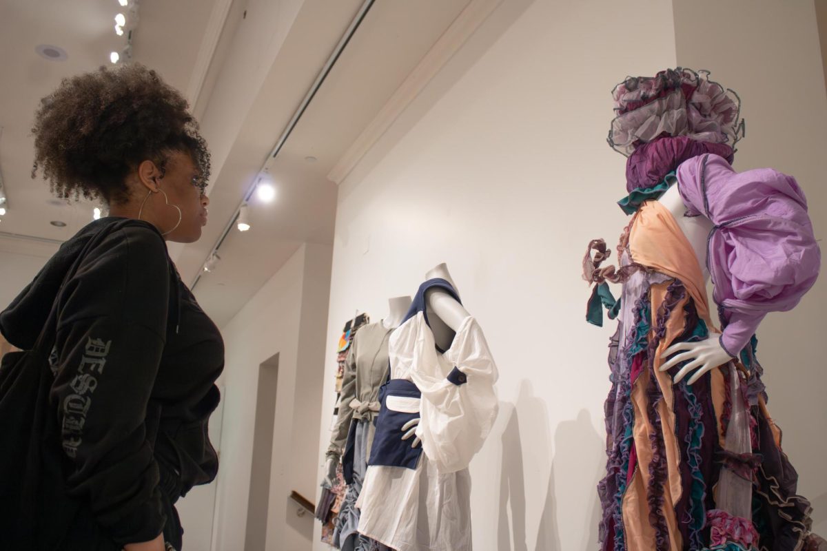 Kent freshman, Brianna Hill, fashion design major views outfits made  in North Africa in the new exhibit, "A Meeting of Cultures: Fashioning North Africa" on Saturday, Sept 6, 2025.
