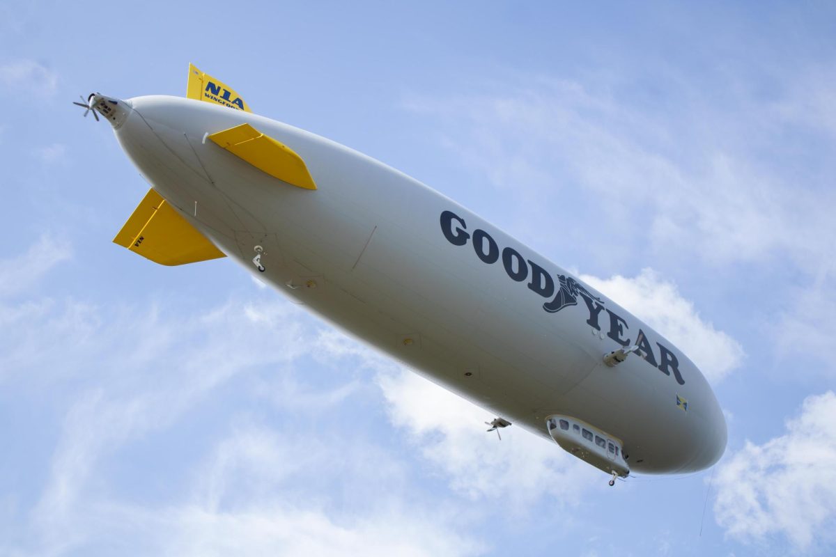 The Goodyear blimp flies through the sky after taking off during the Aeronautics and Engineering Expo on Saturday, Sept. 6, 2025.