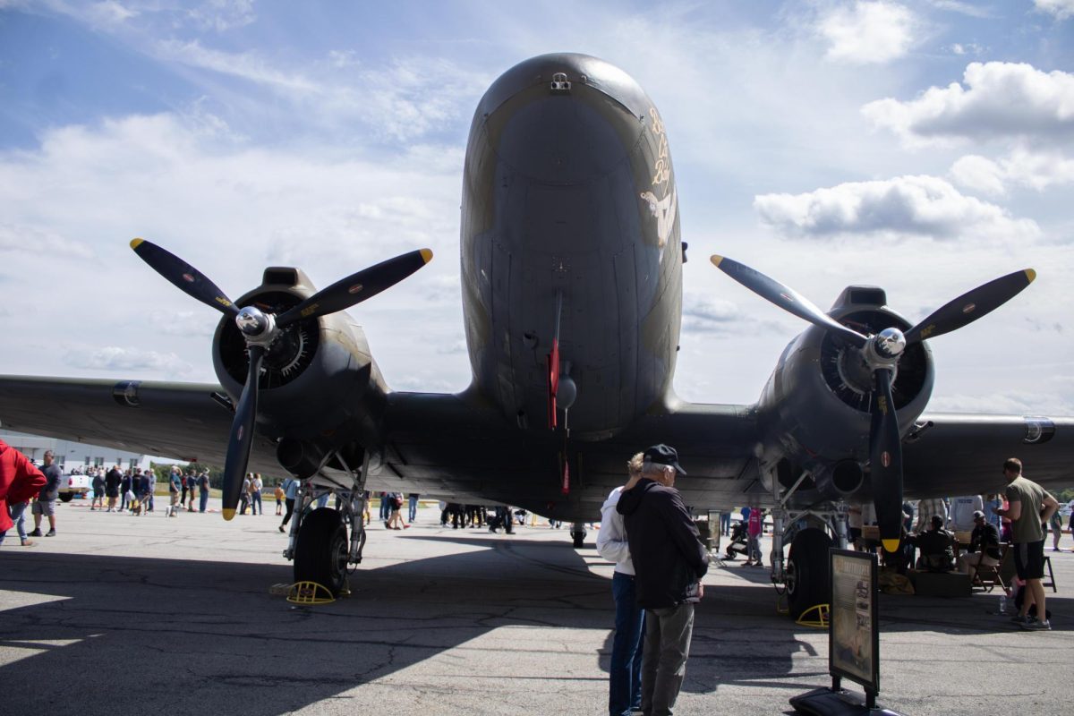 Hudson residents, Lynn and Mary Ann Stephens reads the C-53 Skytrooper description during the Aeronautics and Engineering Expo on Saturday, Sept. 6, 2025. 
