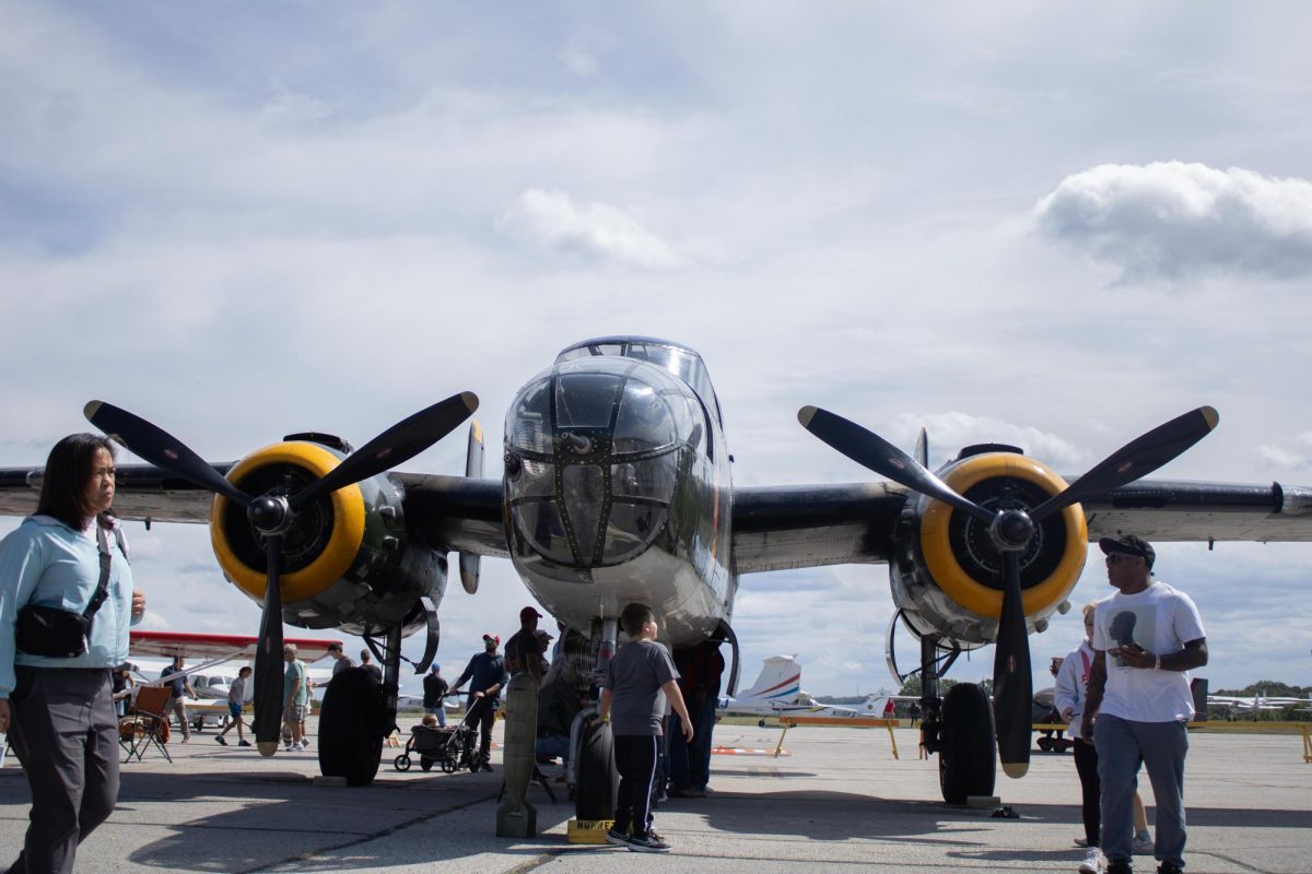 A B-15 Bomber, a World War II Aircraft is shown to people as they gather around to look at it during the Aeronautics and Engineering Expo on Saturday, Sept 6, 2025.