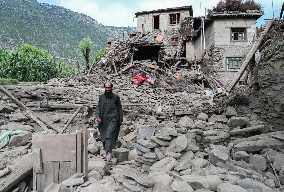 A man walks clambers over a collapsed house in the Mazar Dara village of Nurgal, on September 1. More than 5,000 homes were destroyed in Afghanistan, according to a government spokesperson.
