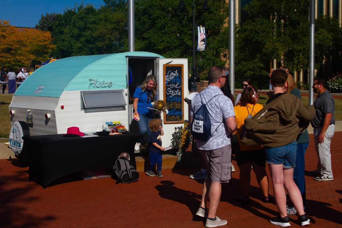 Attendees wait patiently for their turn in a mobile photo booth at the annual Black Squirrel Festival on Sept 12, 2025.