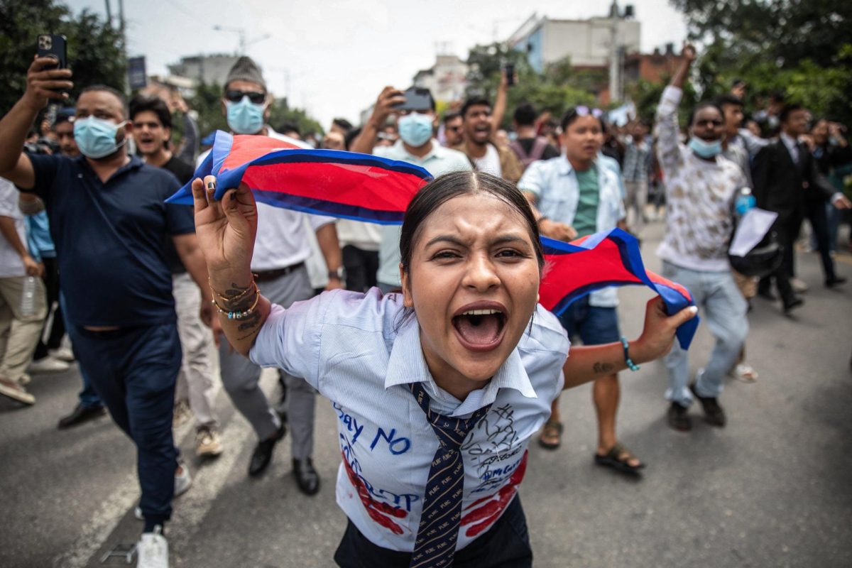 A demonstrator shouts slogans during a protest outside the Parliament in Kathmandu.