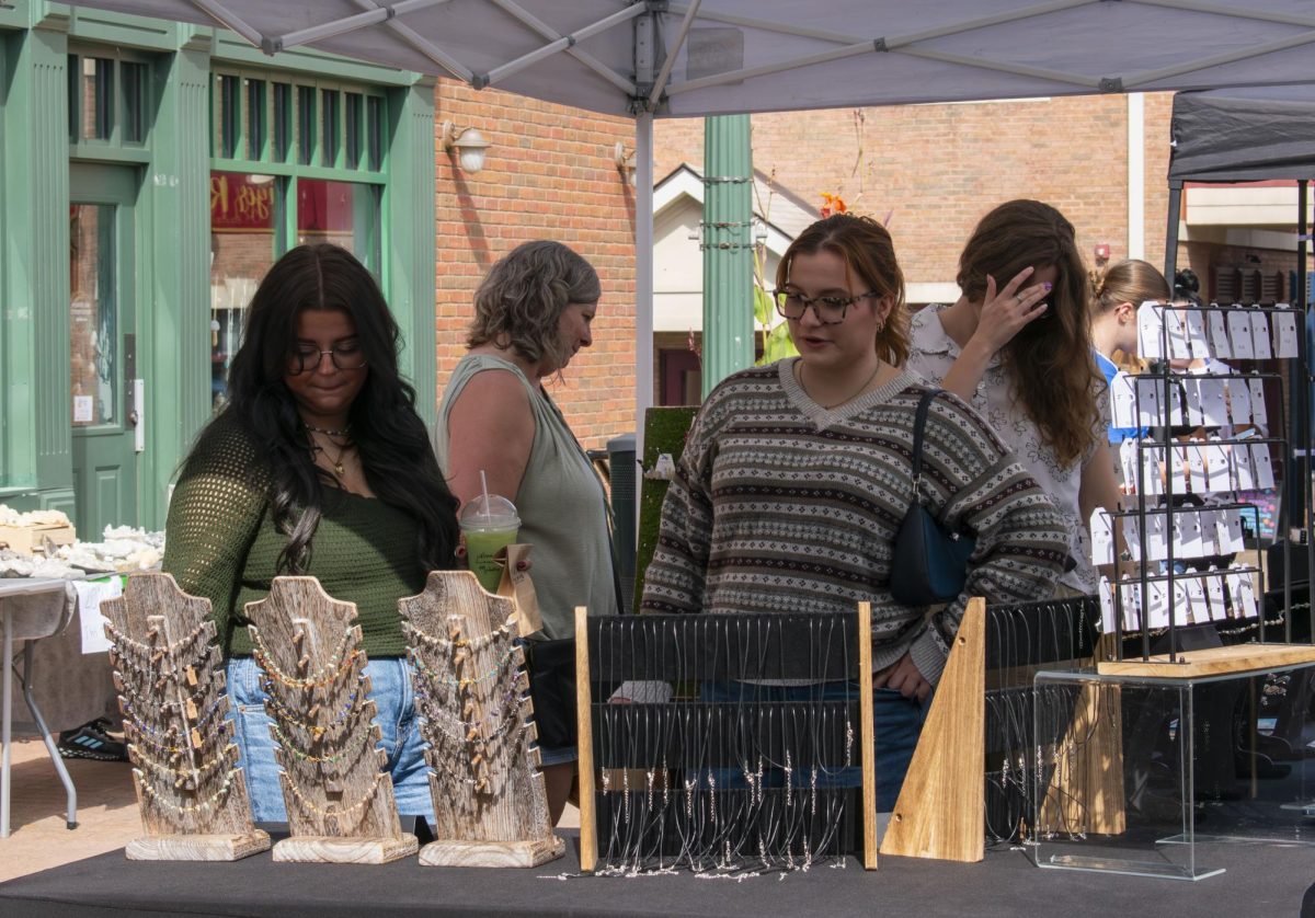 Kent visitors, Leah Vendetti (left) and Ali Kiphart (right), attend Gem Show in Acorn Alley on Saturday, Sept. 27, 2025.