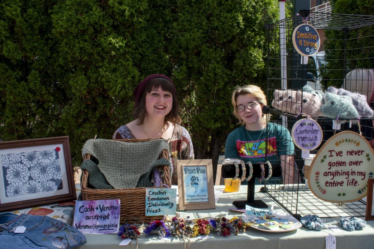 Kenna Elick, Kent State University alumni, and Kim Johnson have a vendor table display at the gem show in Acorn Alley on Sept. 27, 2025.
