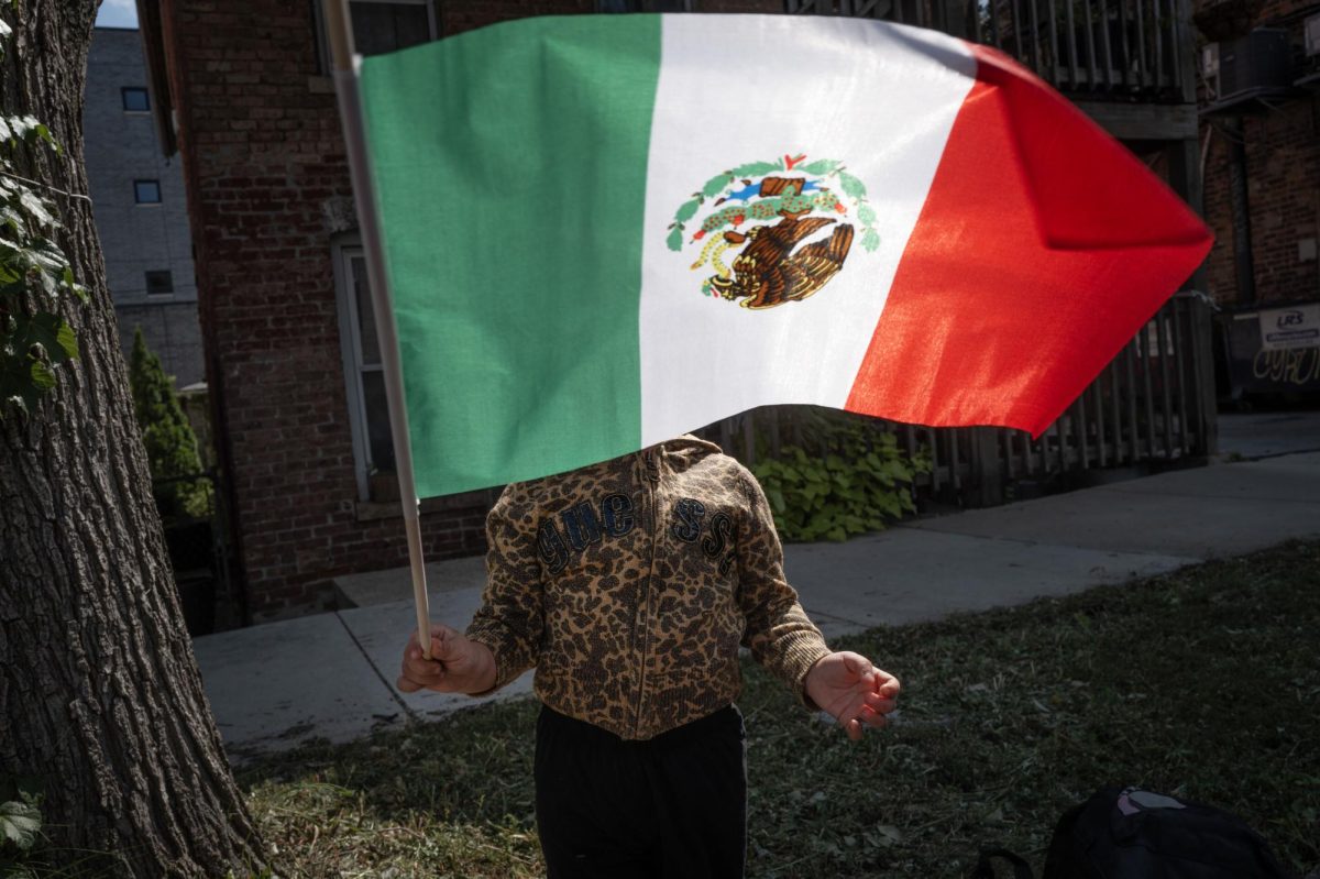 Keilina Zamora prepares to participate in the Mexican Independence Day parade in Chicago's Pilsen neighborhood on Saturday.