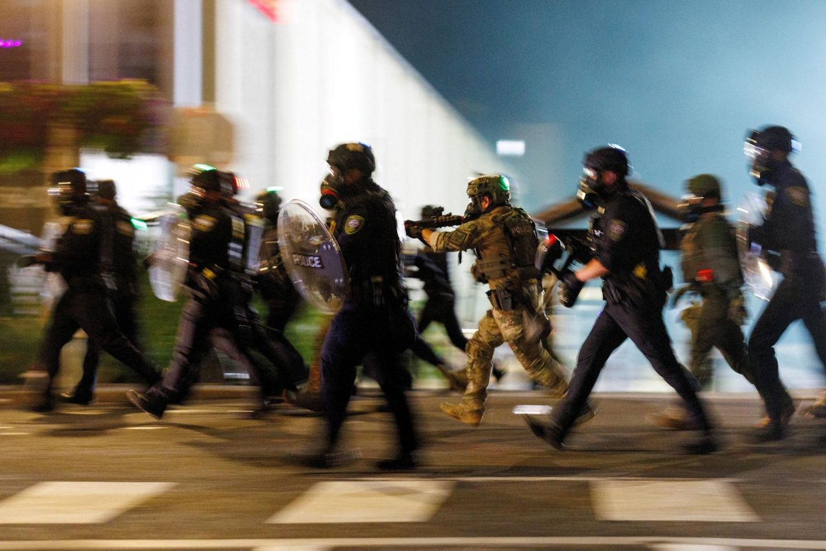 ICE agents charge towards protesters during a protest against the U.S. President Donald Trump administration's immigration policies, outside an ICE detention facility in Portland, Oregon, U.S., September 1, 2025.