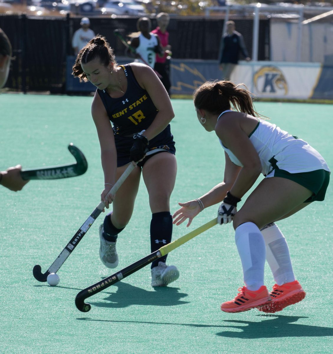 Kent sophomore, Marissa Skinner, moves the ball down the field as Ohio University sophomore back, Ava Hershberger, tries to defend her during their game on Friday, Oct. 17, 2025.