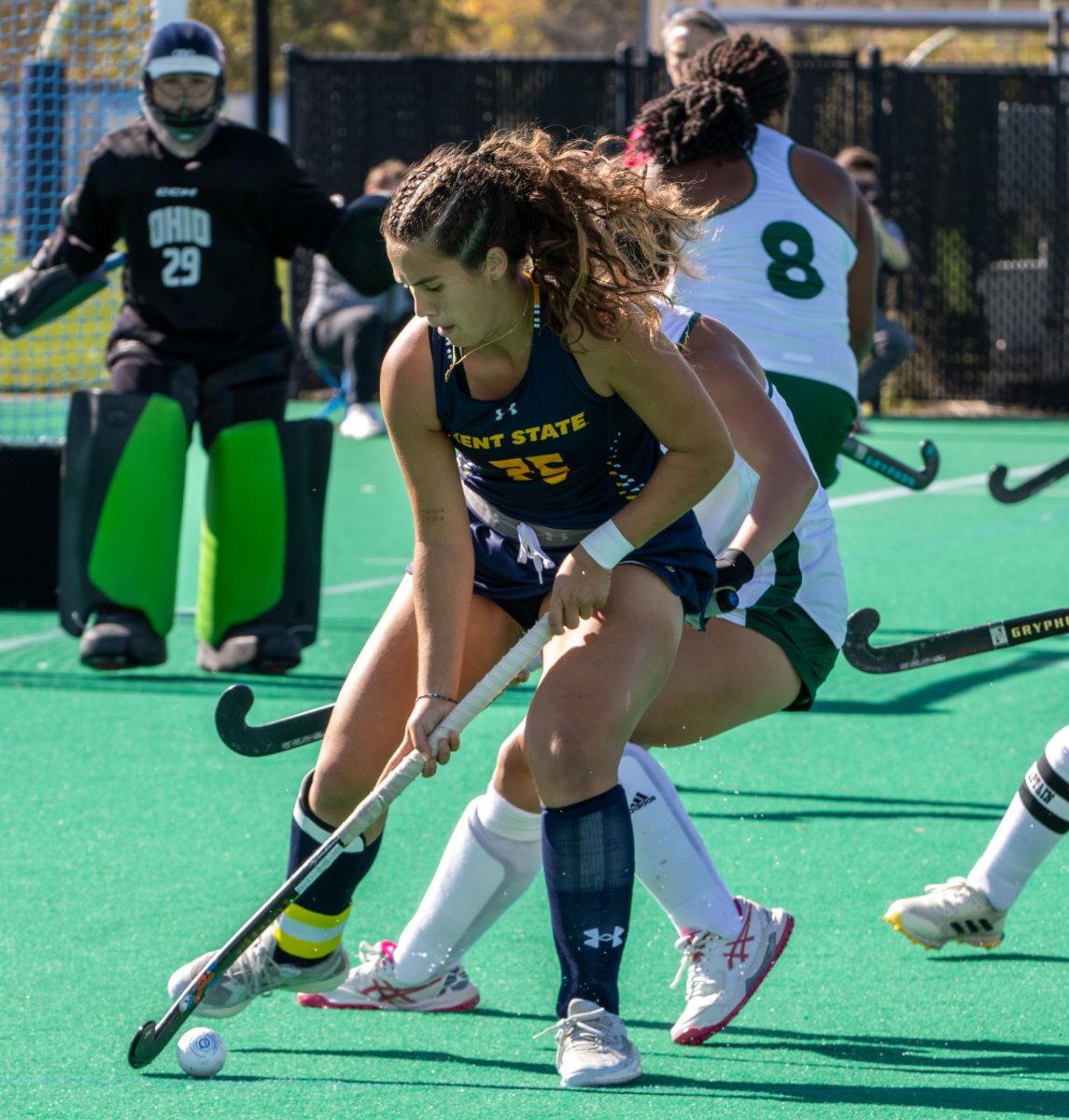 Kent midfilder junior, Eva Usoz, moves the ball towards the goal as Ohio University freshman back, Hanna Scheessele, tries to defend the goal during their game on Friday, Oct. 17, 2025.