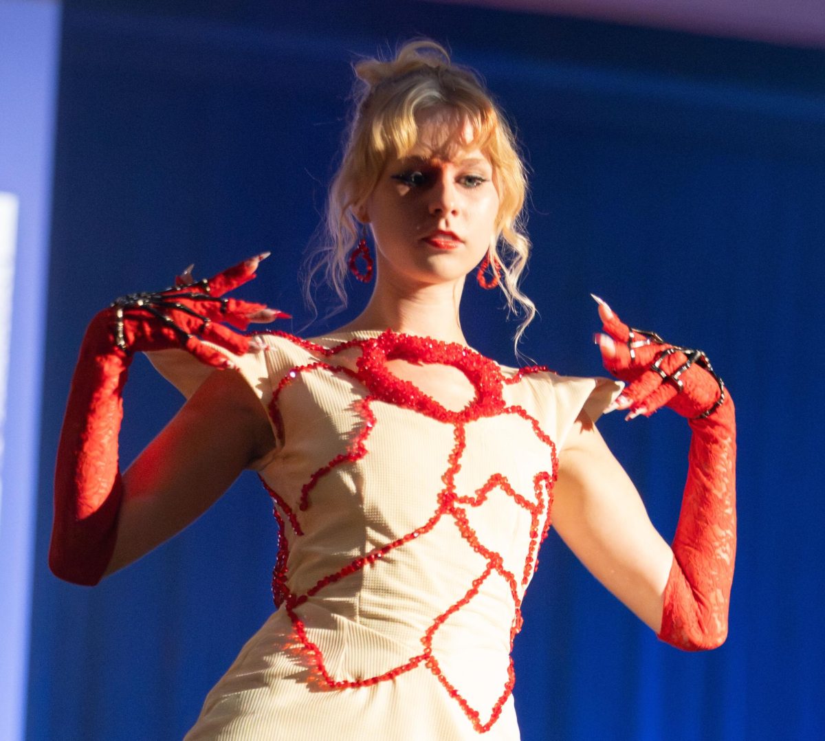 Kent student model Eleanor Bartley strikes a pose as she wears Kent designer Victoria Austin's design during the Modista X Phi Delta Epsilon Fashion Show on Saturday, Oct. 18, 2025.