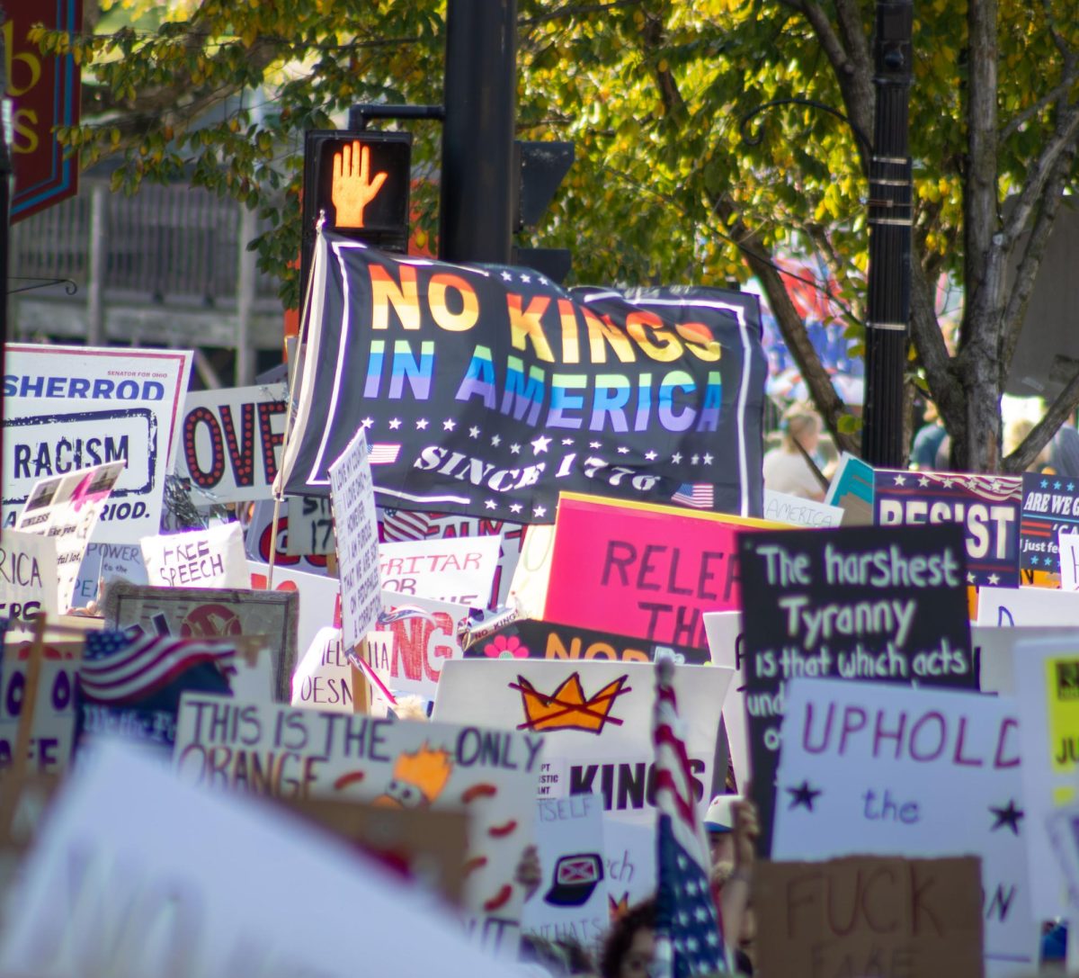 Protesters march up East Main Street hill during the No Kings Protest on Saturday, Oct. 18, 2025.