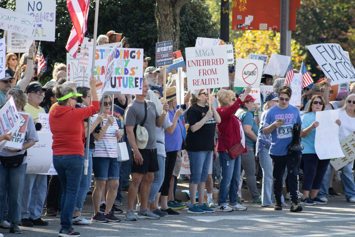 Residents of Kent and nearby towns protest together for the "No Kings" protest on East Main Street on Saturday, Oct. 18, 2025.