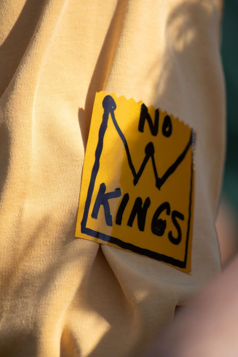 An attendee of the march wears a "No Kings" on their shirt for the No Kings protest on Saturday, Oct. 18, 2025.