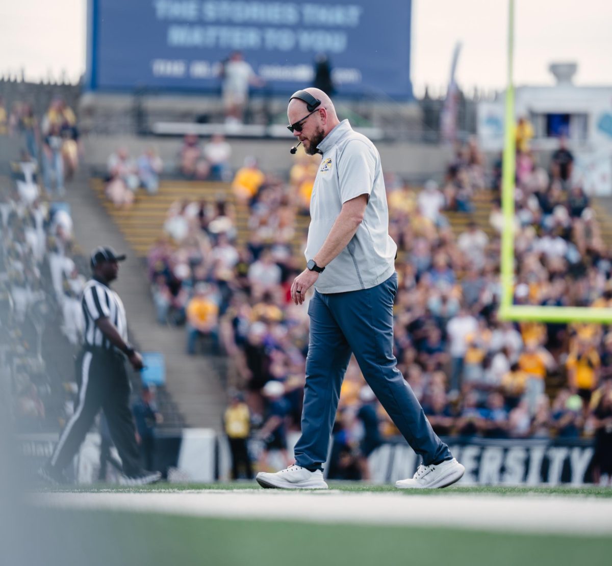 Interim Head Coach, Mark Carney, walks back to the coaches box during the fourth quarter of their game against Toledo on Oct. 18, 2025.