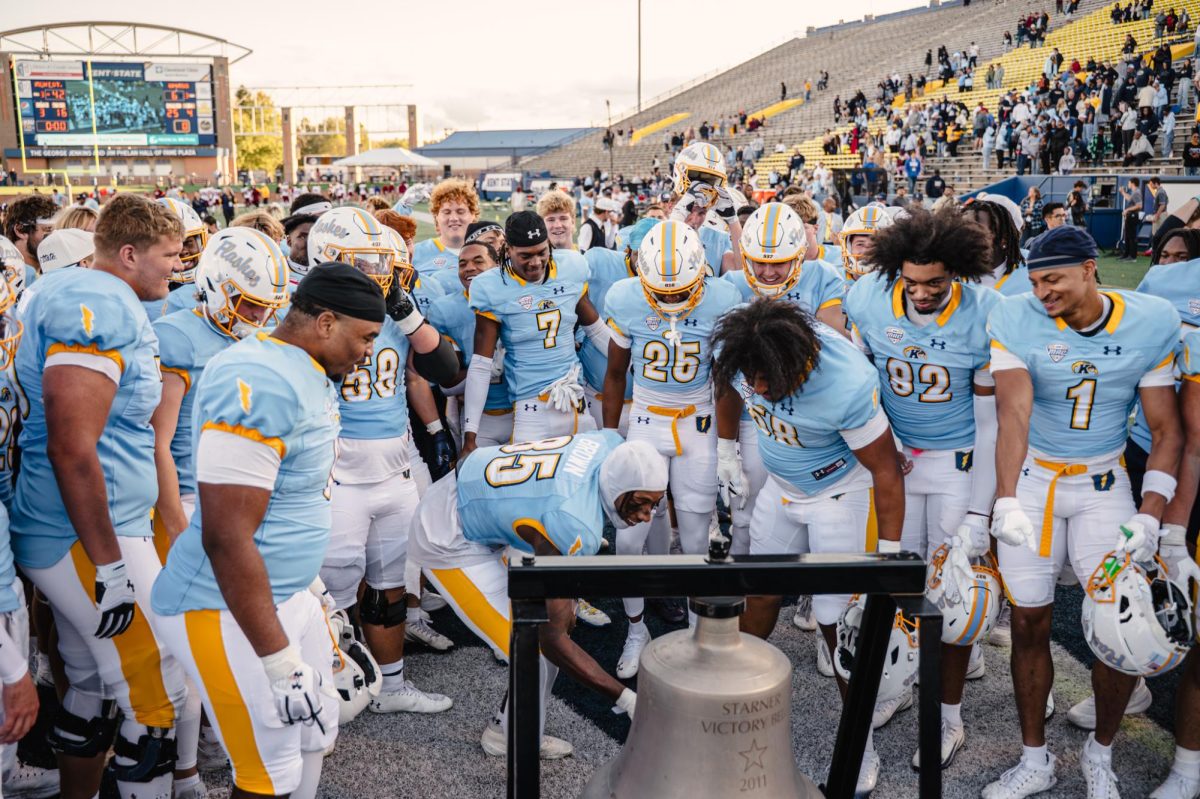 Kent State graduate student Sebastian Brown rings the victory bell after Kent's win against UMass Oct. 11, 2025.