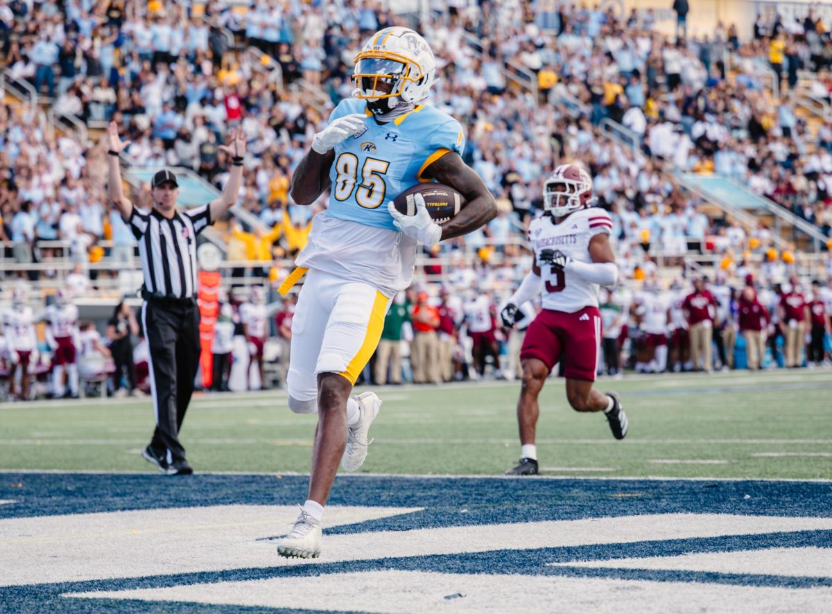 Kent graduate student Sebastian Brown runs to the endzone scoring a touchdown in the first quarter against UMass on Oct. 11, 2025.