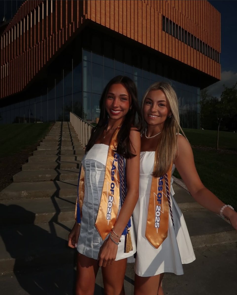 Seniors Alyssa Kosovan (left) and Riley Wolfe (right) come together for photos to celebrate their accomplishments and what’s to come